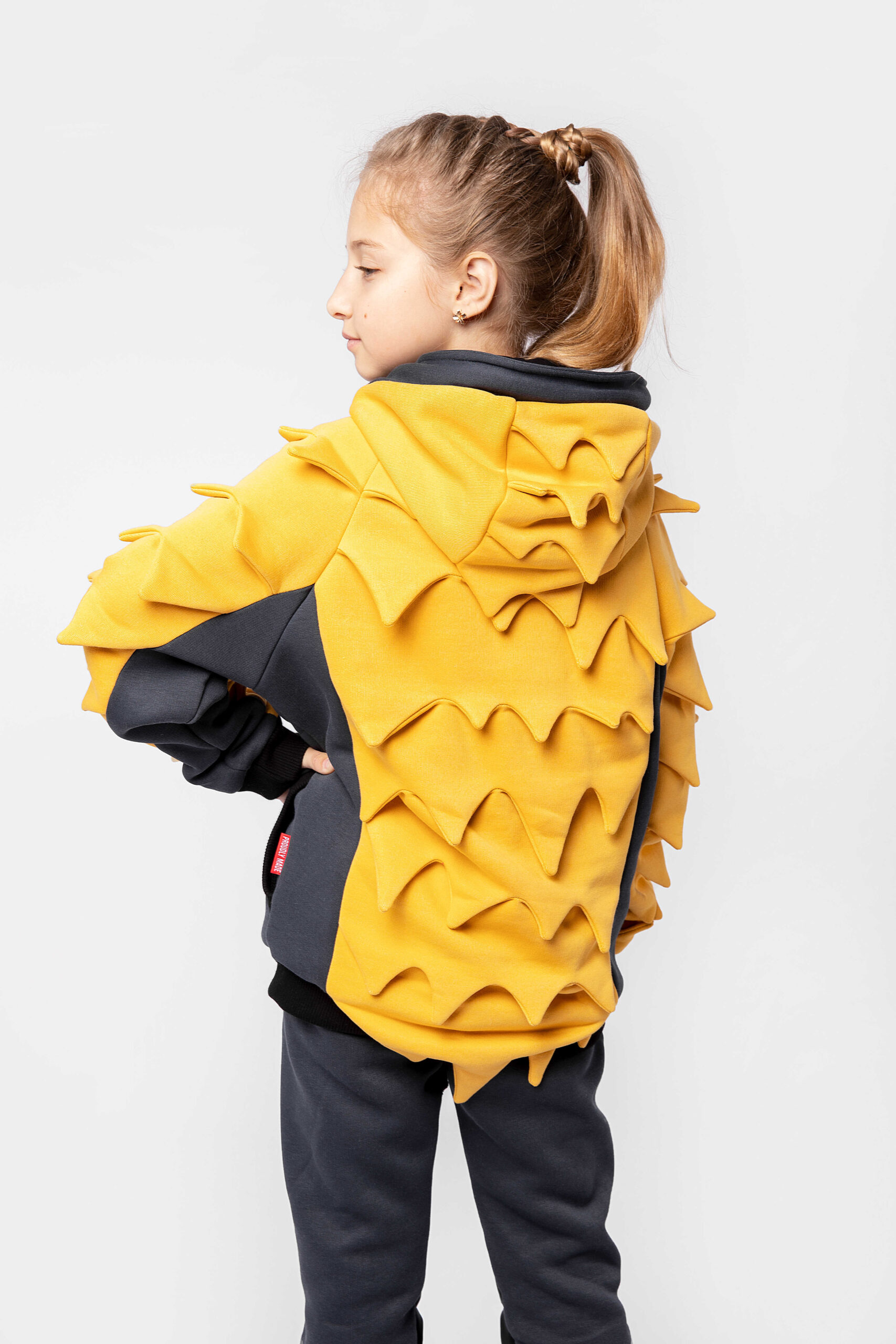 Kid`s Hoodie Pangolin. Color yellow. 
Material of the hoodie – three-cord thread fabric: 77% cotton, 23% polyester.